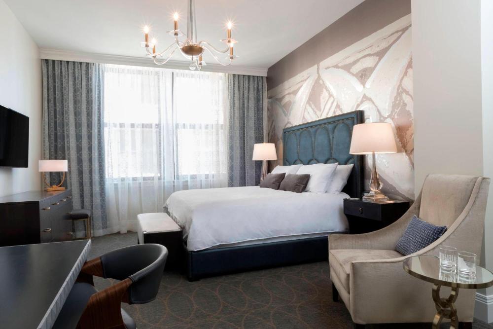 Guest room with King or Queen Beds and a sofa interior